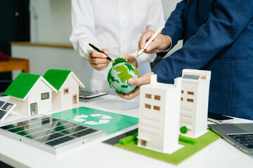 Business team people planning hand using laptop for working technology and business Net zero and...