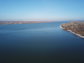 Expansive river landscape with clear blue sky on a tranquil day