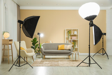 Professional photo studio equipment prepared for shooting living room interior