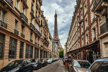 Paris street view with Eiffel Tower and classic architecture.