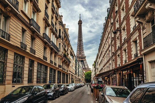 Paris street view with Eiffel Tower and classic architecture.