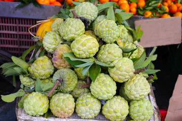 Fresh custard apple fruits for sale at a local market in Vietnam.
