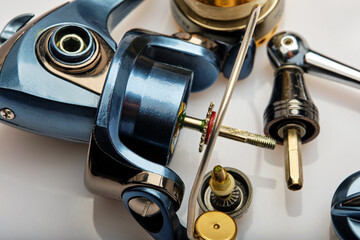 partial disassembly of a spinning reel for maintenance and cleaning, close-up