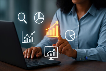 Obraz premium Black woman using laptop and analyzing business analytics with glowing graph interface