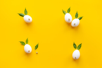 Frame of Easter bunny made of eggs and willow buds. Happy Easter concept