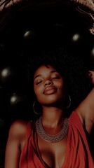 African woman relaxing outdoors in sunlight wearing red and jewelry