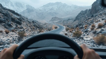 A driver s perspective of a winding road through a rugged desert landscape  long title A first person view from the driver s seat as the vehicle