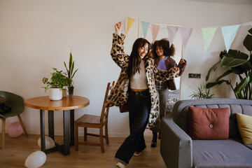 A 25-year-old European woman wearing a leopard-print coat, walking out of a room with a happy smile...