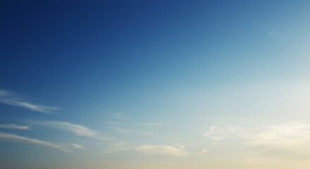 Fototapeta premium Serene Sunset Sky: A Canvas of Blue and White