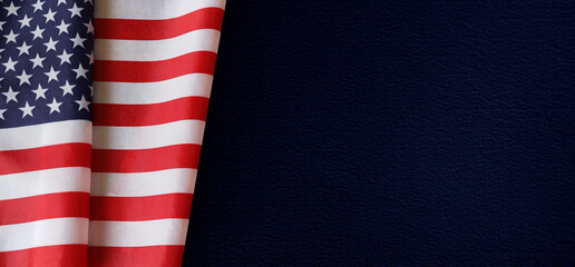 American Flag on Dark Blue Background &ndash; Patriotic Concept symbolizing patriotism, freedom, and national pride. Perfect for memorials, holidays, or political themes with copy space.