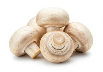 A group of five white button mushrooms clustered together on a plain white surface in a studio shot isolated on white background