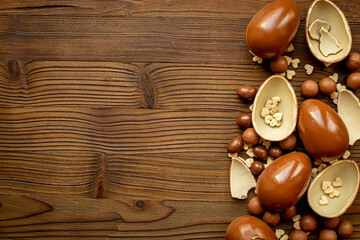 Cracked and whole chocolate eggs, top view