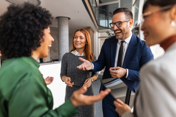 Group of Colleagues Engaged in a Professional Conversation During a Meeting