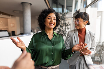 Cheerful Businesswomen in an Office Having a Positive Discussion and Collaboration