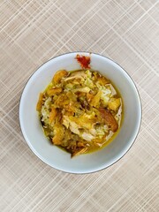 Chicken soto with potato chips topping