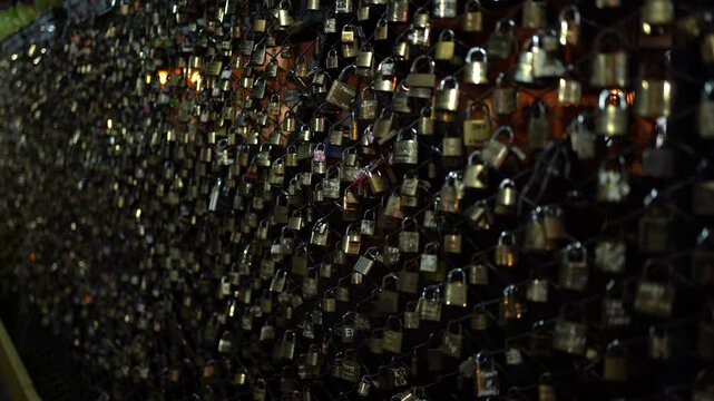 Night view of Puente Pantigoso with love locks in Aguas Calientes, Peru