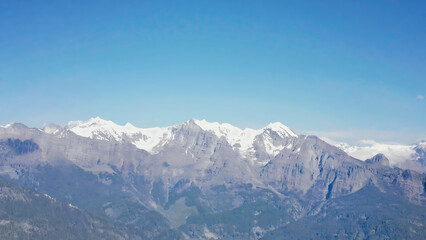 Snowy mountain peaks under blue sky