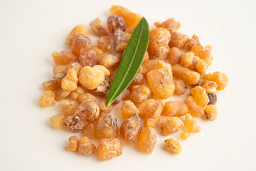 Frankincense or olibanum aromatic resin isolated on white background used in incense and perfumes.