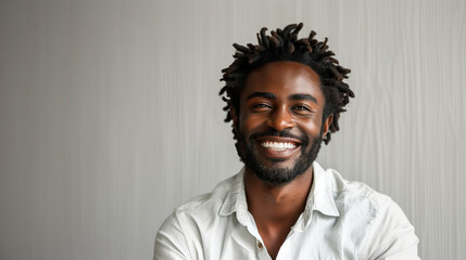 Fototapeta premium African American man smiling joyfully against a neutral background 