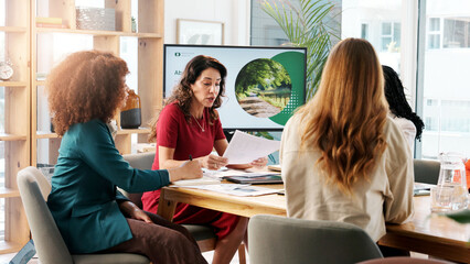 Business, women and presentation for climate change in office, planning and ideas of environment solution. People, meeting and brainstorming with proposal documents, eco friendly information and tips