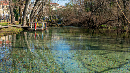 Stunning view from the springs of Agia Barbara. A small complex of springs, rivers and lakes that surrounds an urban park on the edge of the city of Drama. Macedonia. Southern Greece.