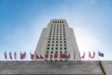 Los Angeles California building with blue sky and american flags