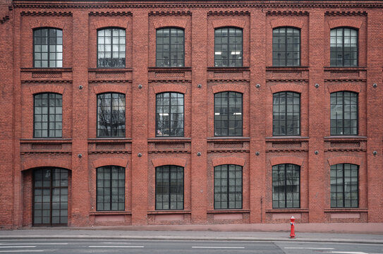 Industrial background, empty grunge urban street with warehouse brick wall