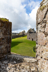 Dunnottar Castle rises in dramatic ruins atop a cliff overlooking the North Sea. Its breathtaking views, rich history, and rugged beauty make it one of Scotland’s most iconic and cinematic locations