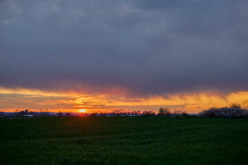 sunset over an agricultural field somewhere in the country