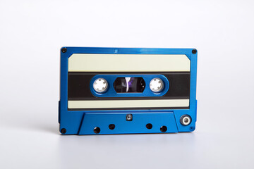 Fototapeta premium Vintage blue cassette tape on a white background showcasing retro audio storage technology