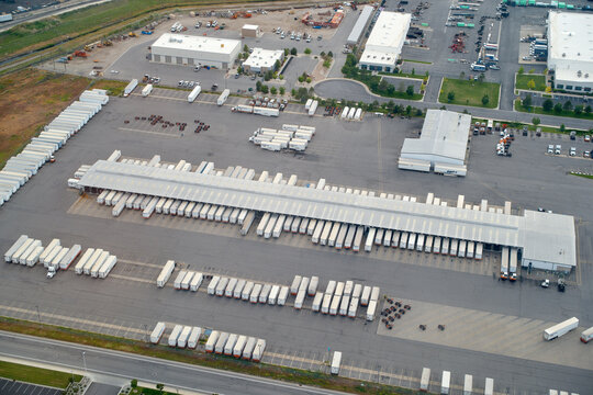 Aerial view of a large distribution center with numerous trucks and trailers parked. Oregon, USA