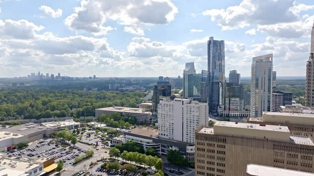 Buckhead highrise and skyline buildings under sunny sky, Atlanta, Georgia, Drone shot