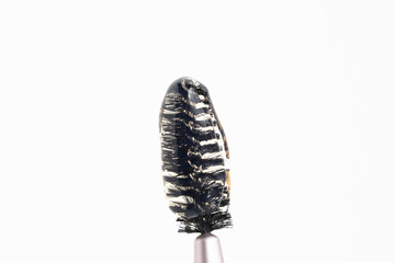 Brush for eyelashes and eyebrows with cosmetic product, styling gel.