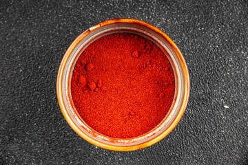 Ground hot red pepper cayenne pepper paprika spice appetizer vegetables dish organic product fresh tasty gourmet food background on the table rustic food top view copy space