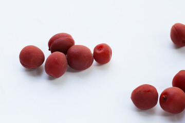 Umeboshi, Japanese pickled plums, Sour and salty taste.