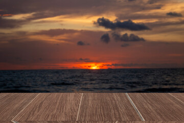 Wooden table top isolated beach background, sky and sunset