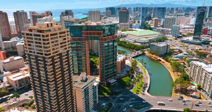 Amazing beautiful modern architecture of Honolulu, Hawaii, USA. Transport moves by the bridges crossing the Ala Wai Canal. Aerial view.