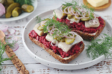 Scandinavian sandwiches with herring and beetroot