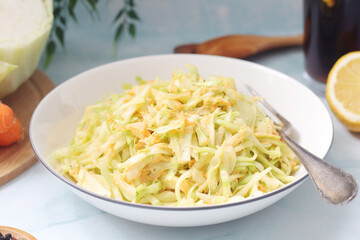 A bowl with coleslow salad