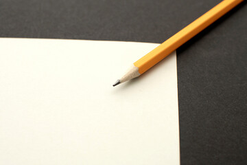 A pencil on black background	