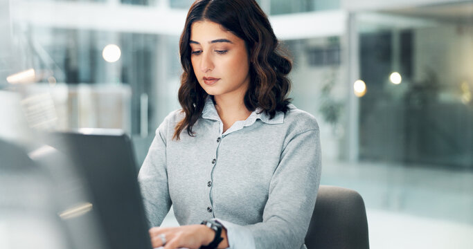 Woman, laptop and typing in office for business, connectivity and article review in agency. Reporter, research and draft on computer for email feedback, story development or reading report for career