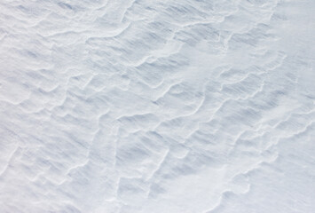 The snow is white and the ground is covered in it