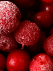A close up of a bunch of red berries with frosting on them