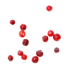 A bunch of red berries are flying through the air