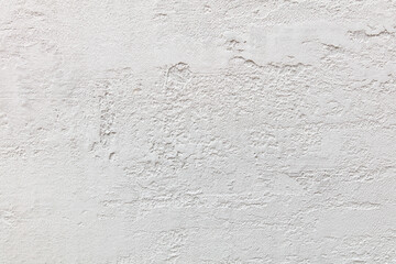 Obraz premium A white wall with a rough texture