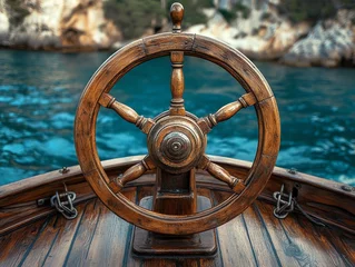 Fototapeten Closeup of a weathered wooden ship wheel on a boat deck sailing on calm turquoise water. Perfect for nautical themed projects or travel advertising. © Nurbaity