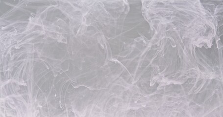 Obraz premium Spreading paint, abstract colors swirling and exploding. An organic background for visuals and motion graphics.