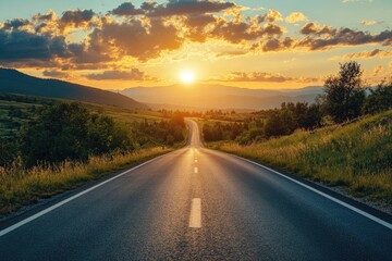 Naklejka premium Winding road leads to sunset