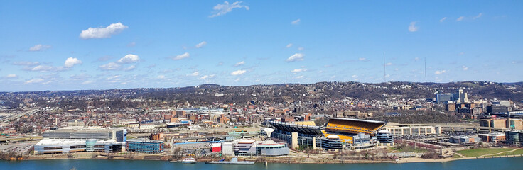 Pittsburgh, Pennsylvania, USA &ndash; April 10, 2024: Panoramic view of Point State Park where the Allegheny and Monongahela Rivers meet to form the Ohio River, with Acrisure Stadium and downtown in view.