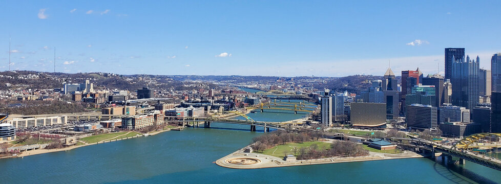 Pittsburgh, Pennsylvania, USA &ndash; April 10, 2024: Panoramic view of Point State Park where the Allegheny and Monongahela Rivers meet to form the Ohio River, with Acrisure Stadium and downtown in view.